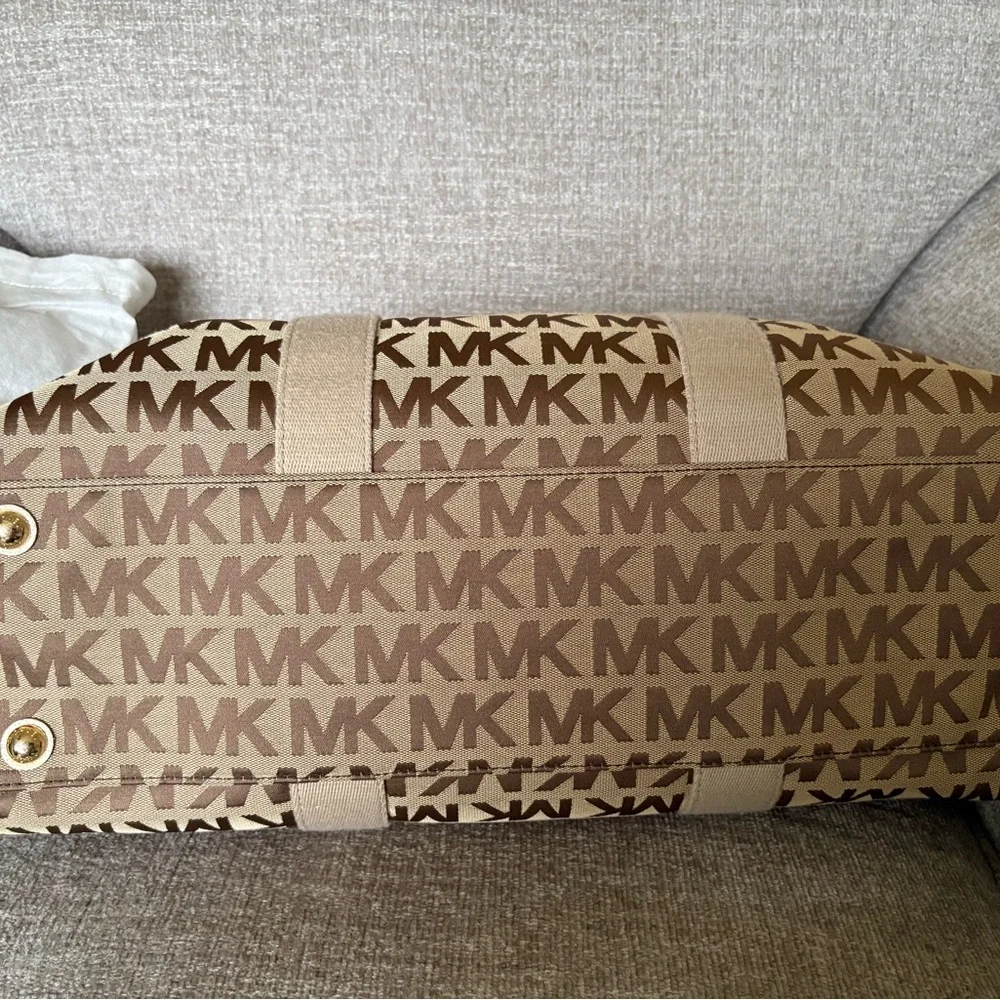 Michael Kors Tan Monogram Duffel Bag this is a womans duffle bag